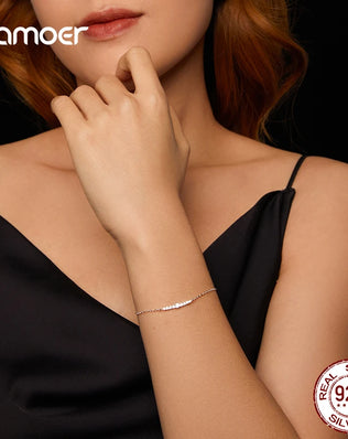 BAMOER - 7 Glittering Moissanite Diamonds Adorn this Sterling Silver Chain Bracelet, Plated with White Gold