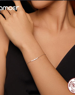 BAMOER - 7 Glittering Moissanite Diamonds Adorn this Sterling Silver Chain Bracelet, Plated with White Gold