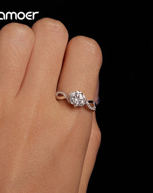 BAMOER 925 Sterling Silver Twist Solitaire Ring with 1CT Moissanite Diamond and Tiny Pave Set CZs