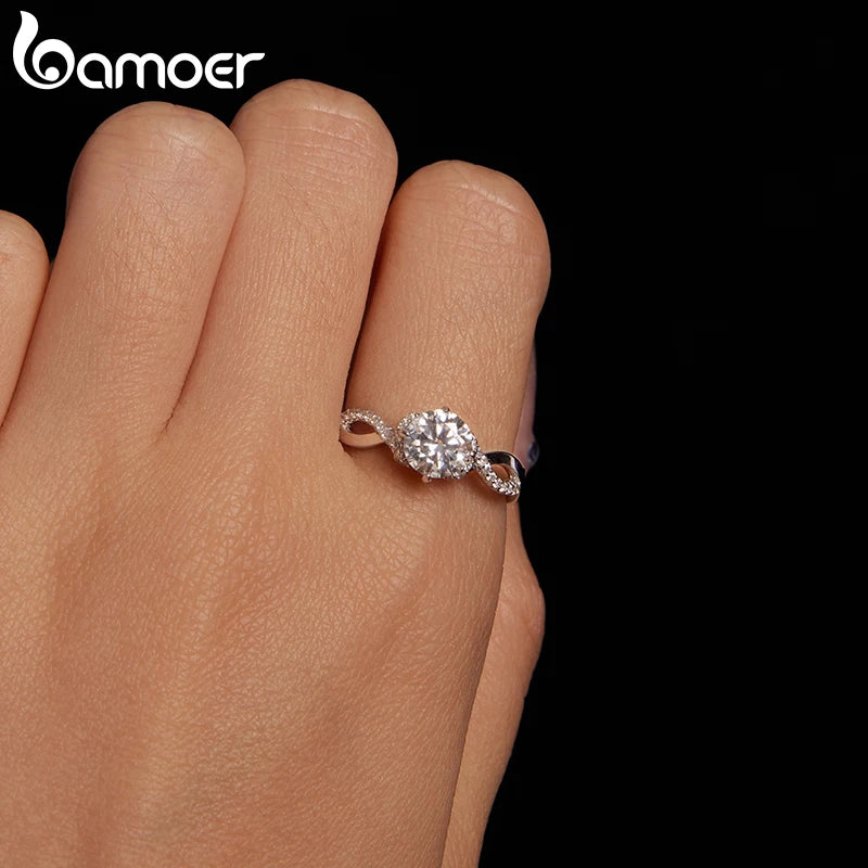 BAMOER 925 Sterling Silver Twist Solitaire Ring with 1CT Moissanite Diamond and Tiny Pave Set CZs